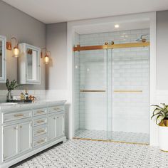 a bathroom with white and gold fixtures, marble counter tops, and tile flooring