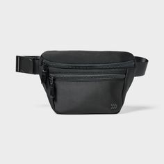 a black fanny bag with zippers on the side and an adjustable belt around it