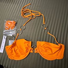 Nwt Small Monica Hansen Beachwear Orange Bikini Top. Halter Tie That Is Removable And Comes With An Extra Strap Without The Ring Detailing. Back Strap With Clasp Closure. Silver Ring Details. Sold At Revolve. Orange Underwire Swimwear For The Beach, Orange Bandeau Swimwear For The Beach, Orange Bandeau Swimwear For Beach, Top Halter, The Ring, Back Strap, Color Orange, Womens Swim, Silver Ring