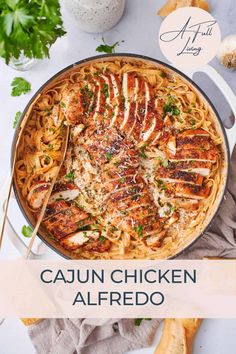 cajun chicken alfredo in a skillet with text overlay