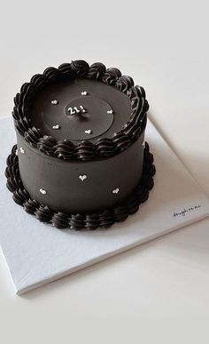 a chocolate cake sitting on top of a white napkin