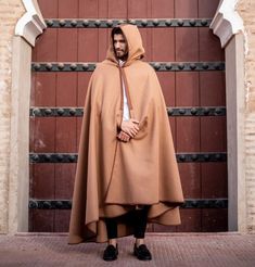 This is the last of this kind and quality. We do have a few other colours available too. Moroccan winter warm brown cape. This cape is long, thick and very warm with a Moroccan style hood and a lovely design of stitching around the cape and hood and tassel attached to add to the unique look and elegance of this cape. Made from a lovely green heavy warm material to keep one lovely and snug while adding a touch of Moroccan charm. This length of this cape is designed to come anywhere between the kn Brown Winter Cape, Brown Wool Cape For Winter, Brown Cape For Cold Weather, Brown Winter Cape For Cold Weather, Winter Beige Cape For Cold Weather, Beige Winter Cape For Cold Weather, Beige Winter Cape, Cape Men, Moroccan Luxury