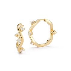 Inspired by her mother, who made golden jewelry from shells found near their home in Southern California, Renna Brown-Taher creates jewels of exquisite quality from the natural world, with minimal impact upon it. The Medium Constellation Hoops feature a wavy hoop shape accented with alternating diamond stones, creating a star-like effect. Secured with a click closure, these earrings will add a sophisticated sparkle to any outfit. Product Details Recycled 18-karat gold. Approximately .95 tcw diam Golden Jewelry, The Natural World, Diamond Stone, 18k Rose Gold, Natural World, Constellations, Southern California, York City, New York City