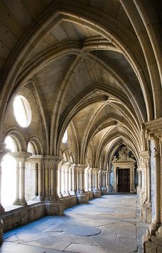 an old building with arches and stone floors