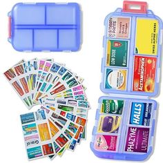 a blue case filled with lots of different types of stickers next to a plastic container