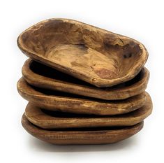 a stack of wooden bowls sitting on top of each other