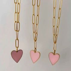 Introducing our stunning Pink Heart Pendant with paperclip necklace, the perfect addition to any jewelry collection. This necklace is designed with a beautiful pink enamel heart pendant that will capture the attention of everyone around you. The pendant hangs from a stylish paperclip chain that is 18k gold plated, giving it a luxurious and high-end look. Not only is this necklace stylish, but it is also practical. It is tarnish-resistant, so you can wear it for years to come without having to wo Pink Charm Necklace For Everyday, Pink Charm Necklaces For Everyday Wear, Everyday Pink Charm Necklaces, Pink Heart Pendant Charm Necklace With Lobster Clasp, Pink Heart-shaped Charm Necklaces With Lobster Clasp, Pink Heart-shaped Charm Necklace With Lobster Clasp, Pink Cable Chain Necklace Gift, Pink Cable Chain Necklace As Gift, Pink Cable Chain Necklace For Gift