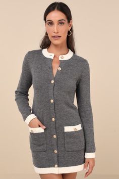 From office afternoons to dressy dates, the Lulus Sophisticatedly Cozy Grey and Ivory Button-Up Sweater Mini Dress is a perfect option! Soft and stretchy sweater knit shapes long sleeves and a crew neckline, both with contrasting ivory ribbed knit trim. A functional button placket secures at the front, with embossed gold buttons for a decadent effect. Two functional patch pockets boast matching decorative buttons, atop a mini hem. Matching contrast trim accents the pockets and hem. Fit: This garment fits true to size. Length: Mid-thigh. Size medium measures 31.5" from shoulder to hem. Bust: Great for any cup size. Waist: Loosely Fitted. Hip: Loosely Fitted. Undergarments: May be worn with any standard bra. Fabric: Fabric is very stretchy. Unlined. 52% Acrylic, 28% Nylon, 20% Polyester. Han Ivory Dresses, Mini Sweater Dress, Button Dress, Knit Mini Dress, Large Size Dresses, Apparel Accessories, Knit Dress, Button Up, Aesthetic Clothes