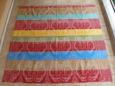 a multicolored table runner on the floor