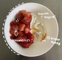 a bowl with strawberries and yogurt in it on top of a table