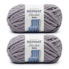 two balls of yarn sitting next to each other on a white background with the words bernat extra