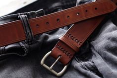 "These every day leather belts are made using thick, durable, full-grain harness leather from the Wickett & Craig tannery. Designed to be at your service for many years, they will take on a wonderful rich character with age. They're 1.5\" in width, with a tapered, low profile tail-end. Its hand-stitched construction is fitted with a solid brass buckle with a muted, satin-steel finish. For added comfort and durability, all edges are rounded and burnished smooth with a soft wax finish. Handcra Rich Character, Custom Leather Belts, Handmade Guitar, Leather Craftsmen, Handmade Belts, Belt For Men, Wide Leather Belt, Belt Leather, Leather Belts Men