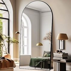 an arched mirror in the middle of a living room