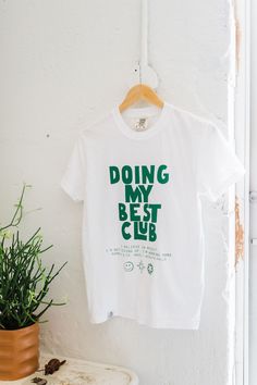 the design: doing my best club; I believe in myself. I'm not giving up. I'm working hard. the color: white tee with forest ink the fit: This is a unisex shirt and runs true to size. Molly is wearing a M. 100% ringspun cotton comfort colors brand tee hand printed care: wash with like colors. Ramble & Company is a family lifestyle brand creating simple, timeless, quality apparel. Each piece is handprinted in our brick and mortar studio located in Wichita Falls, Texas. Non Profit Shirt Design, Simple Tee Design, Trendy Vinyl Shirt Ideas, Book Tshirts Ideas, Unique Merch Ideas, Club Tshirt Ideas, Tshirt Merch Design, Cute Cricut Shirts, Popular Tshirt Designs