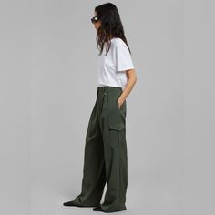 The Frankie Shop Elm Wide Cargo Pants - Olive New With Tag- Never Worn The Elm Wide Cargo Pants In Olive From Frankie Shop Blend Functionality With Style. Featuring A High-Rise Waist And Wide-Leg Silhouette, These Pants Offer A Contemporary Twist On Classic Cargo Pants With Their Utility Pockets And Relaxed Fit. High Waist Green Cargo Pants For Workwear, Baggy Green Cargo Pants For Work, Green Baggy Cargo Pants For Work, Green Cargo Trousers For Workwear, Green Utility Style Wide Leg Pants, Green Utility Pants With Loose Fit, Green Utility Pants With Loose Hips, Loosely Fitted Green Utility Pants, Green Utility Pants For Work