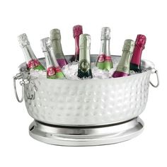 a silver ice bucket filled with champagne bottles