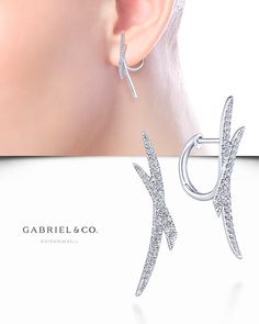 Tapered pavé diamond tendrils are layered atop these 0.39ct huggie earrings for a look that is simply striking. Graceful curves add a touch of femininity to the bold design. These 14k white gold huggie earrings will maximize your accessory impact.  EG13416W45JJ #GabrielNY #DiamondJewelry #GabrielAndCo #UniqueJewelry #FineJewelry#FineJewelry#FashionJewelry#UniqueJewelry#GiftIdeas#UniqueGifts #Earrings #FashionEarrings Mens Gold Diamond Rings, Hand Jewelry Rings, Gold Huggie Earrings, Womens Earrings, Luxury Earrings, Diamond Jewelry Designs, Minimal Jewelry, Huggie Earrings, Hand Jewelry