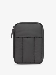 a black case with zippers on the front and side, sitting against a white background