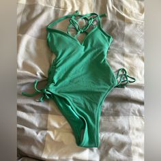 Stoney Clover Green Swimsuit Green Beachwear Bodysuit For Beach Party, Green Bodysuit For Beach Party, Green Bodysuit For Beach Season Party, Green Halter Neck Bodysuit For Spring, Spring Green Halter Neck Bodysuit, Green Triangle Top Bodysuit For Poolside, Green One-piece With Lined Body For Vacation, Green One Piece With Lined Body For Vacation, Green Backless Swimwear For Spring