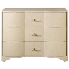 a white dresser with four drawers and two doors