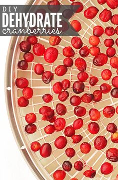 a bowl filled with cranberries sitting on top of a table