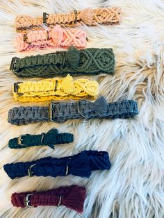 six different colored headbands on a white fur rug with one knoted and the other knoted