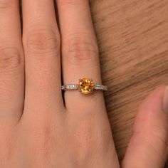 It is a natural citrine ring. The main stone is 7mm*7mm round cut, weight about 1.40 carats. The basic metal is sterling silver and plated with rhodium. To change the metal to a solid gold (white/rose) or platinum is also available, please ask for a quotation if you want. You can also go to my shop Home for more elegant rings: https://www.etsy.com/shop/godjewelry?ref=hdr_shop_menu Peridot is August birthstone Customization is always welcome and please feel free to contact with me if you have any Yellow Stone Ring, Gem Engagement Rings, Yellow Stone Rings, Elegant Rings, November Birthstone Ring, August Birthstone, Yellow Stone, Citrine Ring, November Birthstone