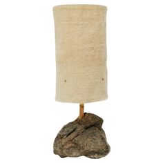 a lamp that is on top of a rock