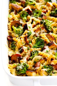 a casserole dish with broccoli, sausage and cheese