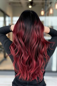 Explore our roundup of 45 elegant and chic black hair/red highlights ideas you should definitely try this year. You'll find looks like the black hair with light red highlights you see here, plus a ton of gorgeous red ombre and balayage ideas. Click through to see all of them now or save this pin for later! Dark Roots Red Hair Ombre, Long Black Hair With Red Underneath, Fire Red Balayage Hair, Red Ombre On Brown Hair, Bayalage Brunette Red Balayage, Red And Black Balayage Hair, Black And Red Balayage, Black To Red Ombre Hair, Light Red Highlights