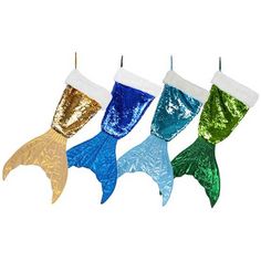 three mermaid tail stockings hanging from a line with sequins on the bottom and sides