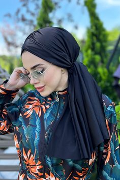 It is one piece. It is made of lycra swimsuit fabric. You can connect it however you want. It is The post Remsa Black Bonnet appeared first on Burkini Remsa. Black Bonnet, Swimsuit Fabric, Unique Beach, Instagram My Story, Tulle Fabric, Head Scarf, Beach Style, At The Beach