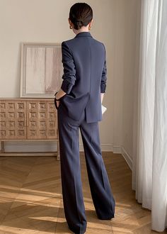 Elevate your office wardrobe with our Clara Double Breasted Blazer & Wide Pants Suit Set. The luxurious grey-blue color exudes sophistication and the wide leg pants give off an elegant and professional vibe. Perfect for the stylish career woman, this set exudes a timeless, British-inspired charm. Blazer: Double Breasted closure Notched lapels Long sleeves Front flap pockets Pants Zip fly with button closure Side slant pockets Regular length - Polyester, spandex- Item #432603- Women's blazer & pa Chic Full-length Suits For Workwear, Chic Full Length Suits For Work, Chic Wide-leg Pants Suits For Office, Elegant Wide-leg Pantsuit For Office, Tailored Wide-leg Office Suits, Tailored Wide Leg Office Suits, Tailored Wide Leg Suits For Office, Elegant Wide-leg Suits For Workwear, Elegant Wide Leg Suits For Workwear