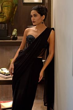 Black saree in chiffon base. Comes with a padded corset with pencil stones, black beads and sequins hand embroidery. - Aza Fashions Saree With Corset, Sarees Black, Solid Saree, Embroidered Corset, Black Saree, Black Chiffon, Black Beads, Aza Fashion, Hand Embroidered