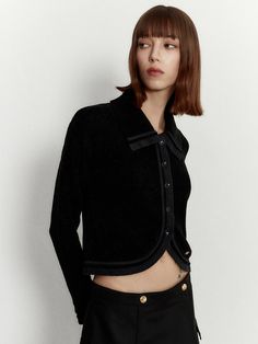 Editor's NoteThis is a black wide-collar crop cardigan that is a tulip-shaped fit. It has not buttons on the front.- Black wide-collar crop cardigan- Tulip-shaped fit- Nut buttons are used - Made with high-quality fabric- Easy to matchMeasurements (in.)One Size (XS-M)- Shoulder: 18.11 in.- Total length: 18.11 in.- Sleeve: 22.05 in.- Bicep: 5.51 in.- Armhole: 6.50 in.- Bust: 18.50 in.Model info: Height: 5' 6 / Bust: 30.31 in. / Waist: 22.83 in. / Hips: 34.65 in.Composition & Care- 33% Cotton, 33% Modal, 34% Nylon- Dry cleaning only- Do not bleach- Do not tumble dryDesigner- by MUDIDI Black Collared Sweater With Buttons, Black Cropped Jacket With Button Closure, Elegant Black Cropped Sweater For Fall, Elegant Black Cropped Sweater For Winter, Classic Cropped Winter Tops, Classic Cropped Tops For Winter, Elegant Cropped Black Cardigan, Elegant Black Cropped Cardigan, Winter Cropped Tops With Button Closure