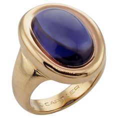 This gorgeous authentic Cartier ring is crafted in 18k yellow gold and bezel-set with an oval purple iolite. Made in France circa 1994. Measurements: 0.47" (12mm) width, 0.86" (22mm) length. The ring size is 6.25 - EU 53. Resizable. Sizing fees will be provided upon request. Excellent condition. Comes with original box. Vintage Cartier Watch, Yellow Gold Cocktail Ring, Iolite Stone, Gold Cocktail Ring, Gold Cocktail, Diamond Cocktail Rings, 18k Yellow Gold Ring, Cartier Ring, Oval Diamond