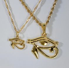 "24 kt Gold-plated Eye of Ra in TWO size options Buy (1) or BOTH! 24 kt GOLD Egyptian Eye of Ra Charm Necklace ❤ Valentine Gift ❤ Birthday Gift ❤ Gift for Mom and /or Son ❤ RA charms are made of Stainless steel and then Gold-plated. FROM OUR PULL-DOWN MENU CHOOSE YOUR SIZE: LARGE ❤ {1} Large 24kt gold-plated EYE of RA charm Measures 30mm/ 1.25 \"wide by 25mm/ 1\" tall Strung on 2mm stainless steel ROPE chain 50cm/ 19.7 inches with lobster clasp. OR SMALL ❤ {1} Smaller 24kt gold-plated Eye of RA Twins Gift, Dope Jewelry Accessories, Egyptian Eye, Eye Of Ra, Egyptian Jewelry, Jewelry Accessories Ideas, Dope Jewelry, Red Jewelry, Jewelry Fashion Trends