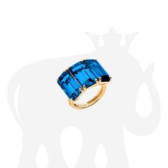 JR0081-LBT-Y 'Gossip' Three Stone Emerald Cut London Blue Topaz Ring in 18K Yellow Gold. Stone size: 13 x 7 mm Approx. gemstone Wt: 14.07 Carats (London Blue Topaz) Luxury Blue Topaz Ring With Polished Finish, Luxury Polished Blue Topaz Ring, Luxury Blue Topaz Ring With Vs Clarity, Can I Keep You, Diamond Accessories, Adult Jewelry, Blue Topaz Jewelry, London Blue Topaz Ring, Ring Settings