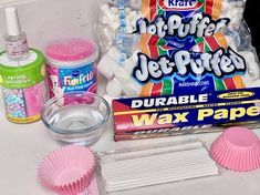 the supplies needed for making homemade wax paper are displayed on a counter top, including cupcake liners and other items