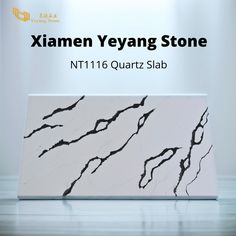 an image of a white marble slab with black cracks on the surface and text that reads ximen yeyang stone nt1116 quartz slab