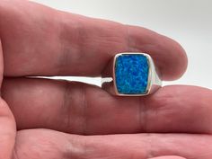 Signet Silver Blue Opal Ring Sizes 7, 8, 9, 10, 11, 12, 13 925 Sterling Silver Face Height: 15mm Weight: 8 plus grams Stone: Lab Created Opal Nickel Free Silver Hallmark 925 Free US Shipping Classic Blue Opal Ring As A Gift, Classic Blue Opal Ring As Gift, Classic Blue Opal Ring For Gift, Classic Blue Opal Ring Gift, Blue Opal Ring Stamped 925 For Gift, Blue Opal Ring For Gift, Fine Jewelry Style, Blue Opal Ring For Gift In Fine Jewelry Style, Blue Opal Ring Fine Jewelry Gift, Blue Opal Ring As A Gift