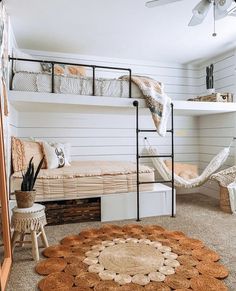 a bedroom with bunk beds and hammock chairs