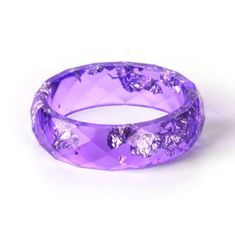 These adorable Colored Resin Rings are perfect for everyday wear. A dashing touch to your accessories and a great way to support animals at risk. You will not only receive compliments but also help to protect our wildlife. This is perfect for you, or as a gift for a loved one. Limited stock, get yours before they're gone Help us raise awareness of the threats animals face. With every Necklace sold you help saving animals across the globe! Help us Save them! Durable Silver Jewelry Gift, Round Durable Jewelry For Gifts, Adjustable Nature-inspired Crystal Ring For Gifts, Adjustable Nature-inspired Crystal Ring As Gift, Purple Round Resin Jewelry, Family Ring, Resin Rings, Purple Rings, Paper Ring