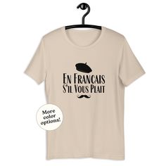 French quote 'En Francais S'il Vous Plait' design for all francophones out there. Perfect as a cute gift for a french teacher or french language major or student, french interpreter or anybody who loves France. In cute pink color. 👕 Unisex Staple T-Shirt | Bella + Canvas 3001. * 100% combed and ring-spun cotton (Heather colors contain polyester) * Fabric weight: 4.2 oz/yd² (142 g/m²) * Pre-shrunk fabric * Side-seamed construction * Shoulder-to-shoulder taping 🧵 I can create listings on other French Teacher Shirt, Paris T Shirt Design, Paris Tshirt Designs, Bonjour Tshirt, Code Clothes, Rose T Shirt, French Teacher, Teacher Student, French Quotes