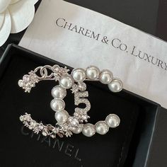 Nwt! Rare! Hard To Come By! Super Beautiful Chanel 23p Cc Logo Signature Silver Crystal Pearl Brooch. This Is The Statement Piece That Will Make You Stand Out On Any Outfit Brand New Boutique Fresh Condition Comes With Full Set W/Tag, & Receipt (Sensitive Info Omitted) Listed Price Is Firm! No Offer Will Be Accepted. Poshmark Will Authenticate Chanel Jewellery, Chanel Flower, Chanel Lover, Ombre Prom Dresses, Chanel Brooch, Classic Chanel, Chanel Box, Chanel Brand, Chanel Inspired