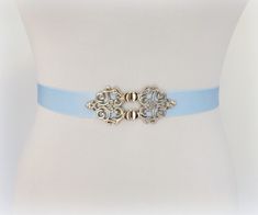 Light blue elastic waist belt with silver filigree clasp. Wedding dress belt. ❤ Belt width: 1" (2.5cm) ❤ Sizes: XXS Fits waists 23"- 25" (58- 63cm) Length end to end 22" (55cm) XS  Fits waists 25"- 27" (63- 68cm) Length end to end 24" (60cm) S  Fits waists 27"- 29" (68- 73cm) Length end to end 26" (65cm) M  Fits waists 29"- 31" (73- 78cm) Length end to end 28" (70cm) L  Fits waists 31"- 33" (78- 83cm) Length end to end 30" (75cm) XL  Fits waists 33"- 35" (83- 88cm) Length end to end 32" (80cm) XXL  Fits waists 35"- 37" (88- 93cm) Length end to end 34" (85cm) 3XL  Fits waists 37"- 39" (93- 98cm) Length end to end 36" (90cm) Custom: If you're not sure about size or need a different size please leave me your waist measurement in the message box at checkout and I'd love to customize the belt t Pearl Wedding Dress Belt, Jeweled Wedding Dress, Lace Tube Top, Jewel Dress, Wedding Dress Belt, Black Jewel, Blue Belt, Beautiful Belts, Dress Belt