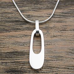 Contemporary Pendant Jewelry, Modern Sterling Silver Rectangular Pendant Jewelry, Modern Sterling Silver Jewelry With Rectangular Pendant, Modern Jewelry With Large Rectangular Pendant, Modern Rectangular Pendant Jewelry With Polished Finish, Modern Sterling Silver Oval Pendant Jewelry, Modern Teardrop Pendant Necklace, Modern Silver Oval Pendant Jewelry, Contemporary Silver Necklace With Round Pendant