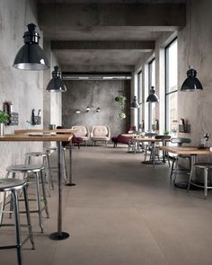 an empty restaurant with tables and chairs