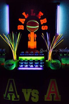 an image of neon lights in the dark at a sports themed birthday party or baby shower