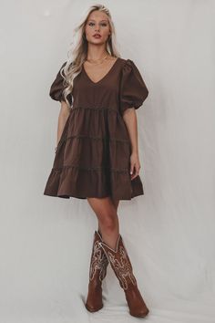 A day in the life of a fashion icon because you in this dress is stunning!!! Dark brown short puff mini dress, tiered style, dress is lined Material is Polyester Hang to dry Model is 5’7 wearing a small SHOP THE LOOK Small Medium Large Length 30” 31” 32” Bust 18” 19” 20” Short Dress With Boots, Country Concert Dress, Puff Mini Dress, Wedding Guest Romper, Country Dress, Party Bottoms, Concert Dresses, Country Casual, Babydoll Mini Dress